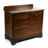 An Edwardian mahogany chest of two short and two long graduated drawers, on bracket feet,