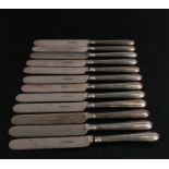 A set of twelve Elkington silver handled dessert knives.