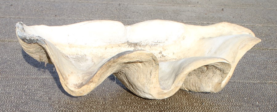 A large fibreglass clam shell, 136cms (53.5ins) wide.