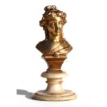 A gilt bronze bust of a young lady, mounted on an alabaster plinth, overall 13.5cms (5.25ins) high.
