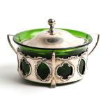 An Art Nouveau silver three-handled butter dish with green glass liner, Birmingham 1905.Condition