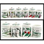 A quantity of Italian Fornasetti ceramic storage jars.