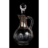 A silver mounted cut glass decanter, 25cms (9.75ins) high.