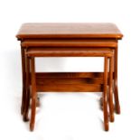 An Ercol nest of three tables, the largest 58cms (23ins) wide.