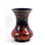 A Moorcroft Pottery vase decorated with fruit, 21cms (8.25ins) high.Condition Report Crazing to