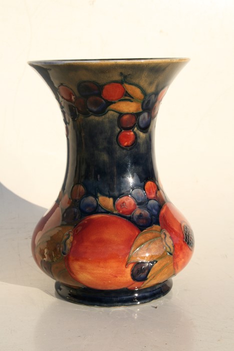 A Moorcroft Pottery vase decorated with fruit, 21cms (8.25ins) high.Condition Report Crazing to - Image 5 of 7