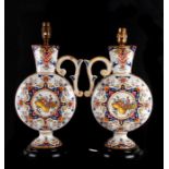 A pair of coloured Delft moon flask ewers, converted and fitted as table lamps, mounted on wooden