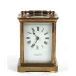 A Mappin & Webb brass cased carriage timepiece, 11cms (4.25ins) high.