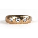 A 9ct gold gentleman's gypsy ring set with three white stones, approx UK size 'T'.