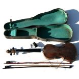 A cased two-piece back violin; together with two bows (a/f)