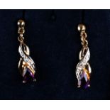 A pair of 9ct gold amethyst and diamond earrings.