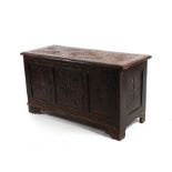 A carved oak coffer, 99cms (39ins) wide.