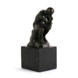 After Auguste Rodin (French 1840-1917) a bronze model - The Thinker - mounted on a black marble