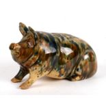 A slipware money bank in the form of a pig, 18cms (7ins) long.Condition Report One ear repaired.