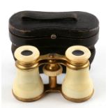 A pair of Victorian ivory opera glasses, cased.