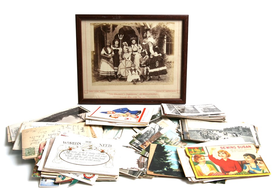 A Victorian photograph depicting 'Her Majesty's Dominions'; together with a quantity of postcards.