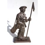 A vintage novelty cast iron fireside companion set in the form of a golfer carrying a bag of clubs