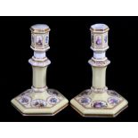 A pair of mid 19th century Paris porcelain candlesticks, a primrose yellow ground with enamelled