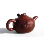 A Chinese Yixing teapot, 6cms (2.25ins) high.