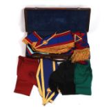 Masonic regalia and sashes contained in a brown leather case