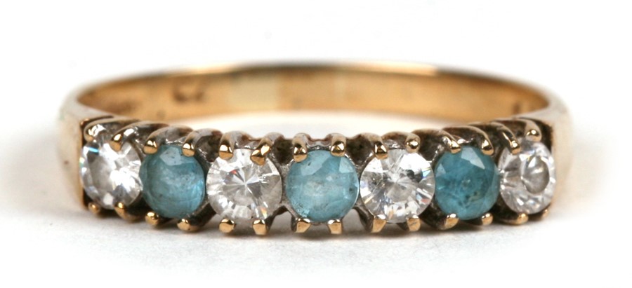 A 9ctr gold ring set with pale blue and white stones, approx UK size 'N'.