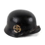 An SS Schalburg Korps combat helmet with liner and chin strap. Production number to the rear: 1187