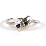 A 9ct white gold diamond and sapphire ring, approx UK size 'R'.