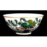 A Chinese famille verte bowl decorated with a landscape, blue seal mark to the underside, 17cms (6.