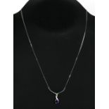 A 9ct white gold diamond and amethyst set pendant necklace.