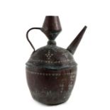 An Eastern / Islamic copper water pitcher with stamped decoration, 30cms (11.75ins) high.