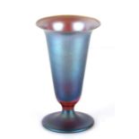 An early 20th century iridescent glass flared trumpet pedestal vase, unmarked but believed to be