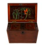 An early 19th century Sinhalese inlaid sarcophagus shaped two division tea caddy, opening to