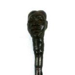 A walking staff carved with an African head handle, 138cms (54.5ins) long.