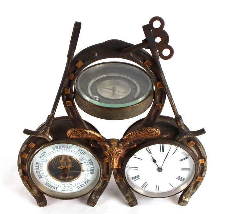 A Victorian desk top clock, barometer, thermometer, of hunting interest, in the form of three