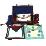 Masonic regalia aprons sashes and documents contained in a brown leather case