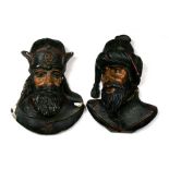 A pair of 18th century continental carved oak heads of bearded men with gesso and painted