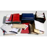 A quantity of stamp albums and loose stamps to include First Day Covers.