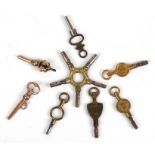 A group of pocket watch keys including two novelty keys.