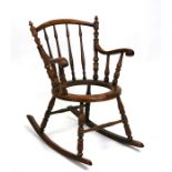 A 19th century walnut rocking chair.Condition Report Lacking upholstered seat pad.