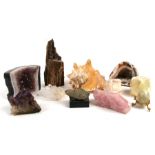 A group of crystals, minerals, geodes and a large shell.