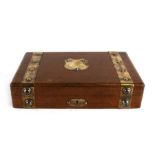 An Edwardian oak and brass bound games box with four internal boxes, one for each playing card suit,