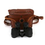 A pair of US Army Wollensak 6 x 30 binoculars in their original leather case marked Wollensak to the