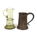 An 18th century copper tankard with original wooden base, 15cms (6ins) high; together with a green