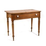 A Victorian stripped pine side table with single frieze drawer, on turned legs, 91cms (36.25ins)