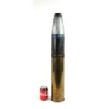 A complete inert artillery shell in two parts standing 73cms (28.75ins) high by 12cms (4.75ins)