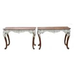 A pair of 19th century (possibly Scandinavian) pine and gesso console tables decorated with