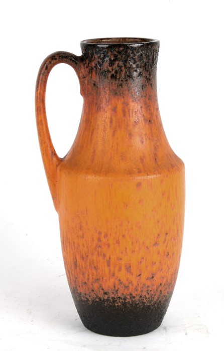 A West German Lava ware jug, 26cms 914ins) high.