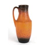 A West German Lava ware jug, 26cms 914ins) high.