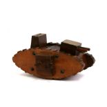 A WW1 wood and brass trench art Tank money box with machine guns and cannons. The turret cannon is