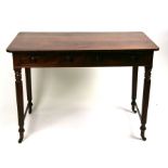 A 19th century mahogany side table with two frieze drawers, on turned and reeded legs, 106cms (